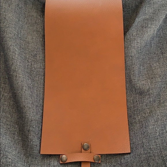 Leather strap and front clasp. Zippers shut. - Picture 2 of 5